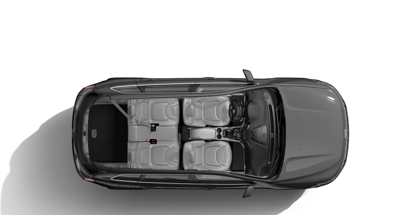 A slider allowing the user to toggle between views of the 2021 Jeep Cherokee with its rear seats folded and raised.