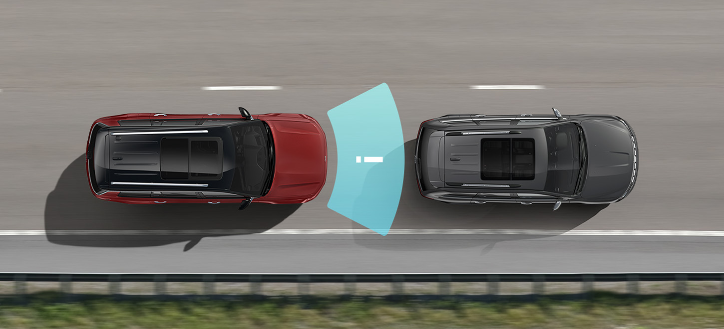 The 2022 Jeep Grand Cherokee on the road with an illustrated sensor beam emanating from its rear to detect the vehicle approaching in the next lane.